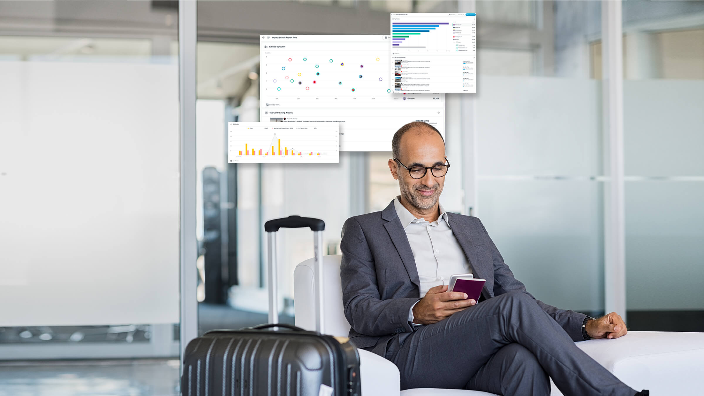 Executive in airport, looking at smartphone