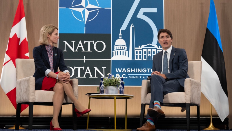 Estonian Prime Minister Kaja Kallas looks on as Prime Minister Justin Trudeau delivers opening remarks at the start of a meeting at the NATO Summit Thursday, July 11, 2024 in Washington. THE CANADIAN PRESS/Adrian Wyld