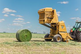 Vermeer G4 Pro Baler emptying a bale into the field. 