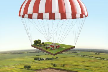 Parachute with land coming back to earth.