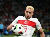 Turkey's forward #21 Baris Alper Yilmaz runs for the ball during the UEFA Euro 2024 quarter-final football match between the Netherlands and Turkey at the Olympiastadion in Berlin on July 6, 2024. (Photo by JAVIER SORIANO / AFP)
