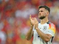 Germany's forward #09 Niclas Fullkrug applauds the fans after the UEFA Euro 2024 quarter-final football match between Spain and Germany at the Stuttgart Arena in Stuttgart on July 5, 2024. (Photo by Fabrice COFFRINI / AFP)