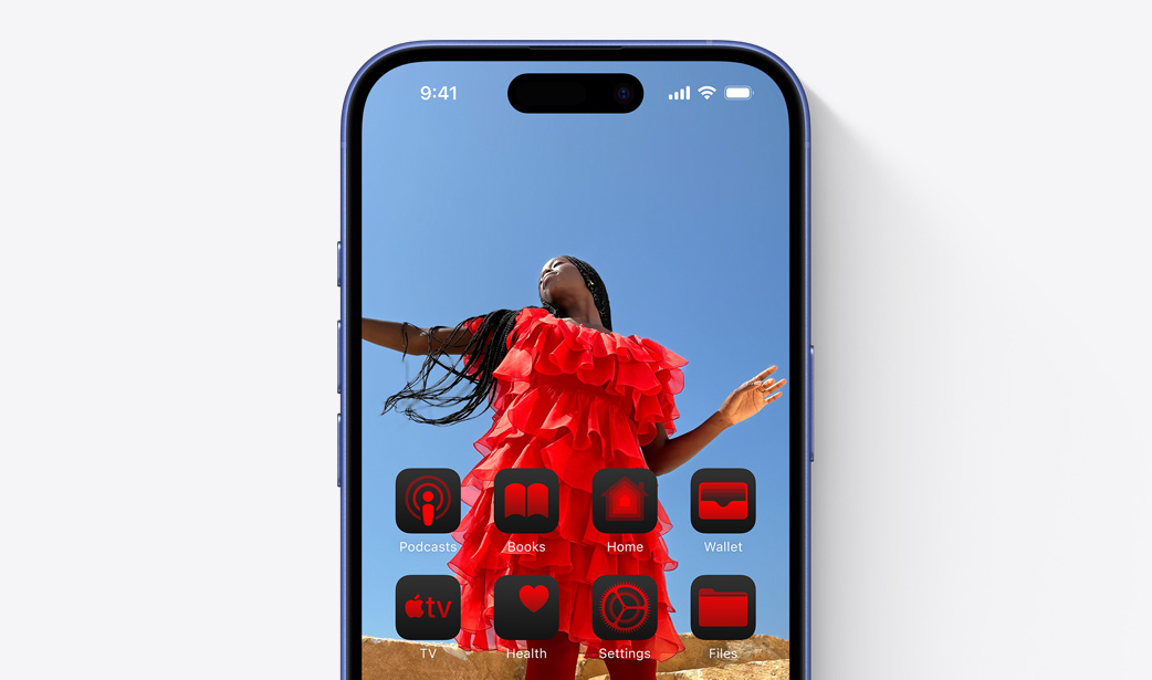 iPhone 16 screen with a photo of a girl in a red dress and widgets tinted a similar colour red.