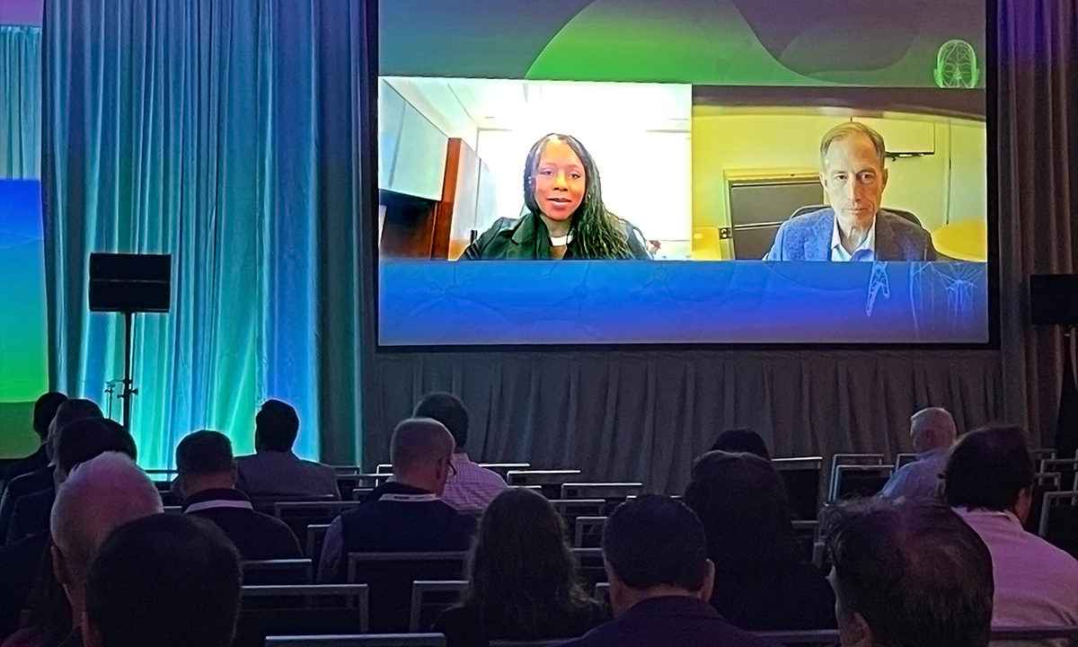 Michelle Tarver and Jeff Shuren appear on a large screen.