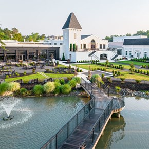 Renault Winery and Resort grounds with fountain and walkway bridge.