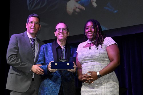 CRDA Executive Director Eric Scheffler, the Spirit of Hospitality Award winner Scott Cronick, and CRDA Deputy Executive Director Maisha Moore.