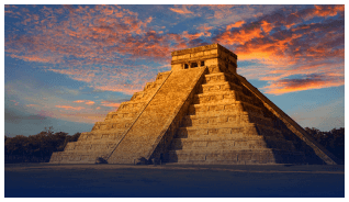 Sunset over a Mayan pyramid, symbolizing immersive travel experiences.