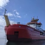 The RRS Sir David Attenborough polar research ship in a body of water in Antarctica