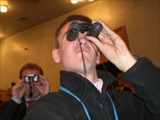 James Reynolds looking through binoculars