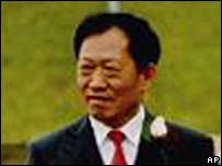 In this photo released by Ran Chen, Wo Weihan escorts his daughter Ran Chen at her wedding in Innsbruck, Austria May 8, 2004