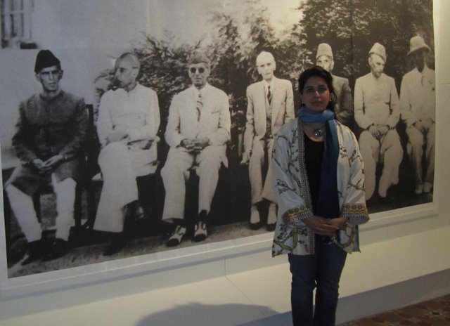 Exhibition curator, Naiza Khan in front of Lahore artist Imran Channa's 'Find the real Jinnah'. The founding president of Pakistan, Mohammed Ali Jinnah, said: 