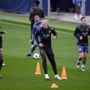 Manchester City striker Erling Haaland was filmed clutching his shin in pain before flying to Lisbon (Nick Potts/PA)