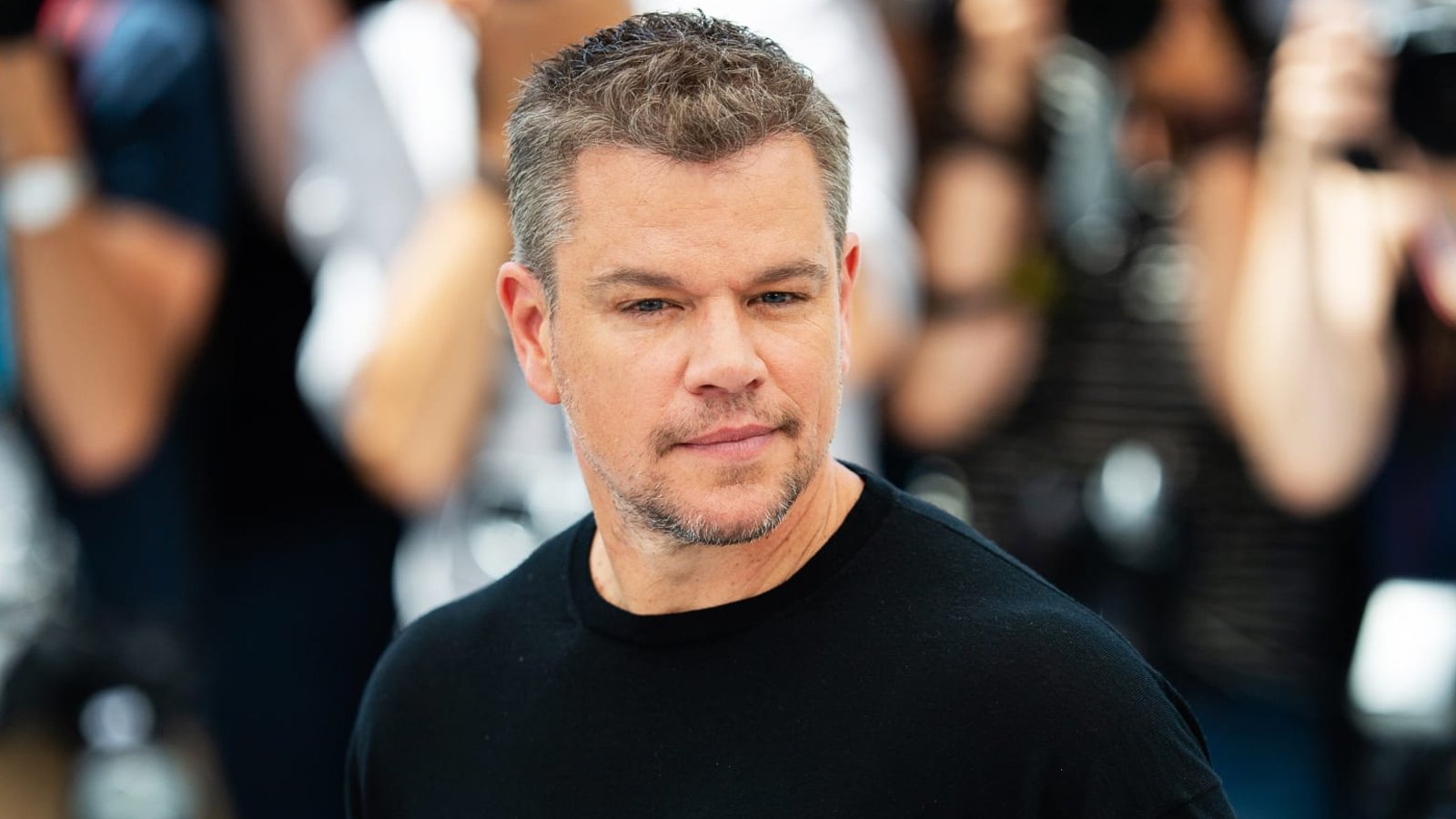 Matt Damon-like man at movie premiere event.