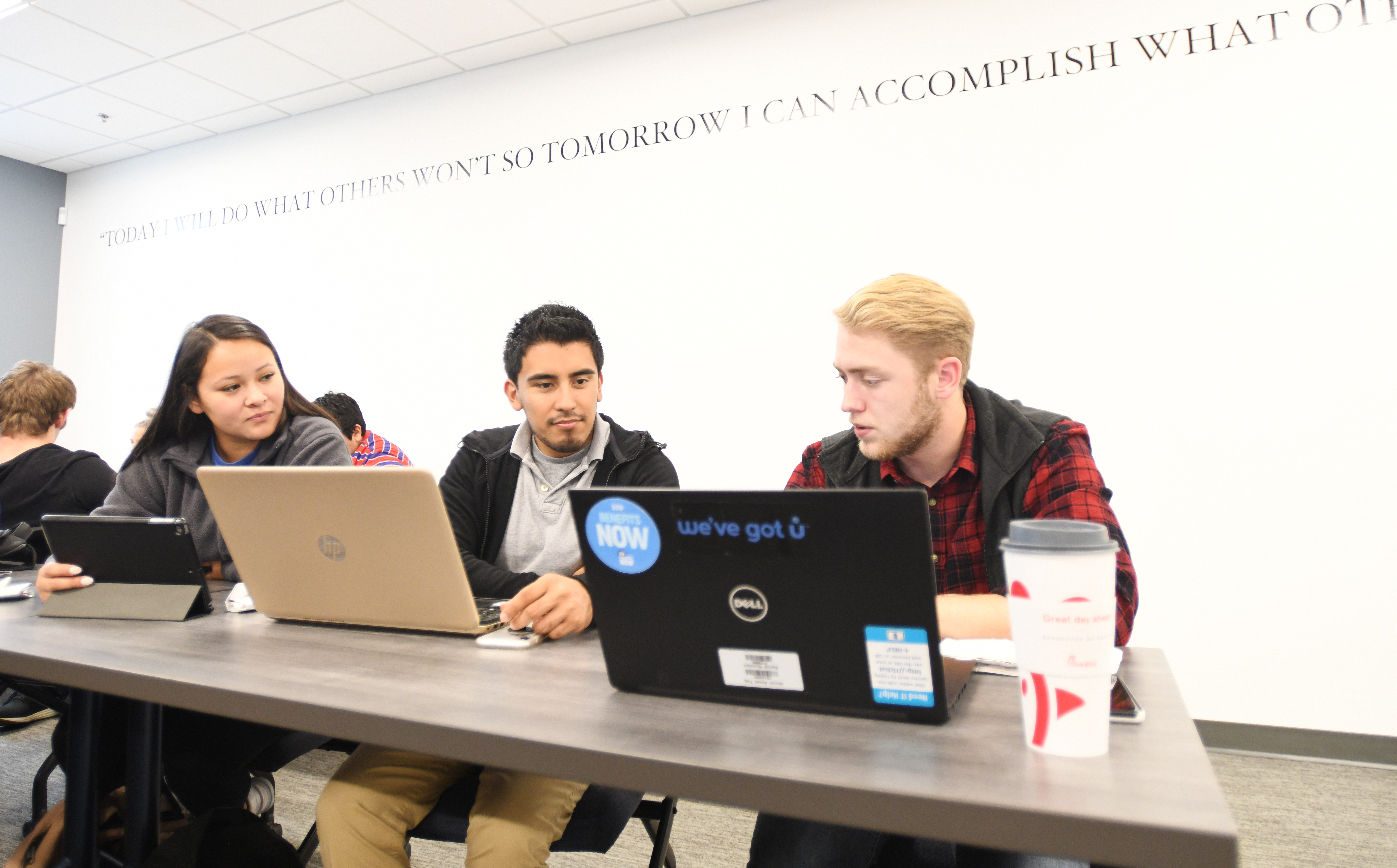 Students in lecture, working at laptops