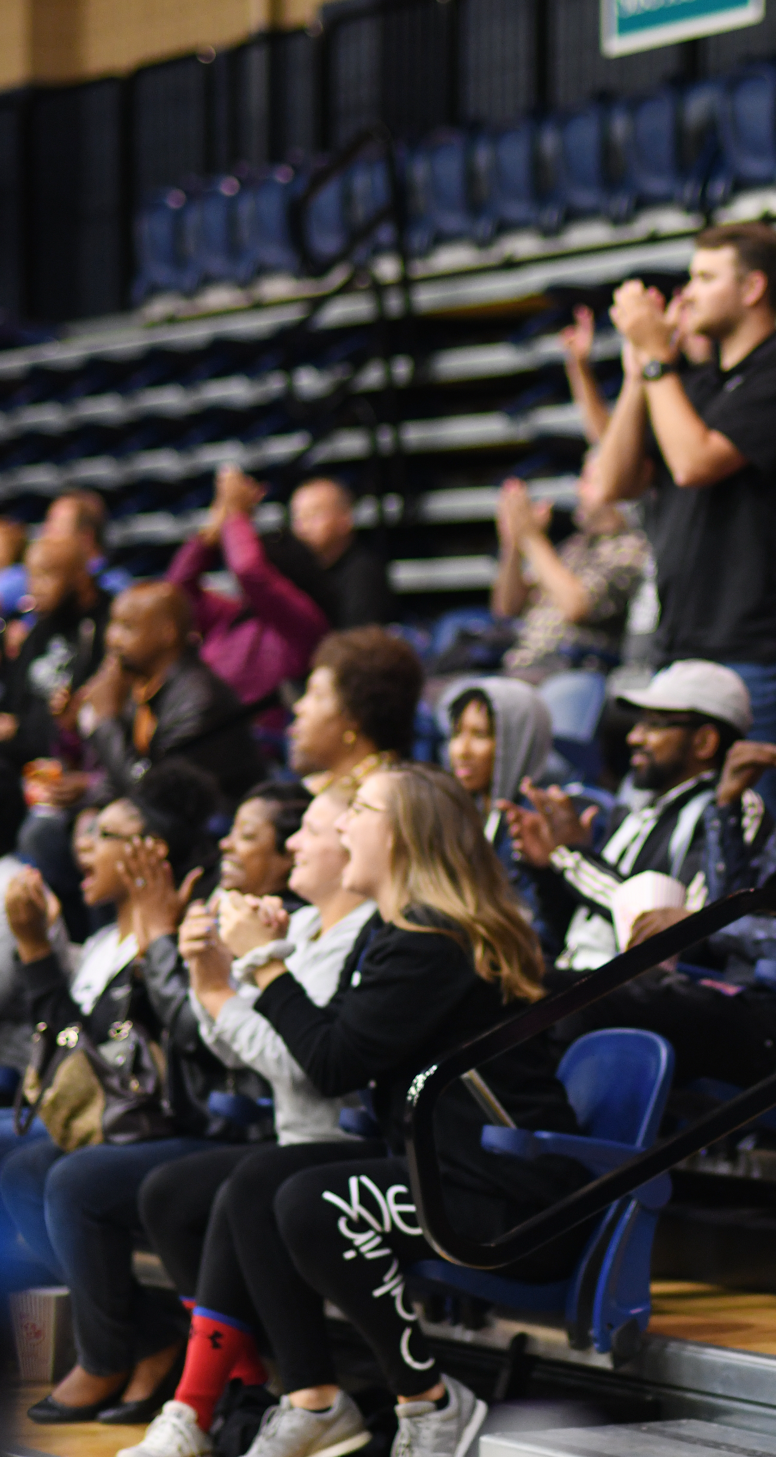 Students in crowd, applauding