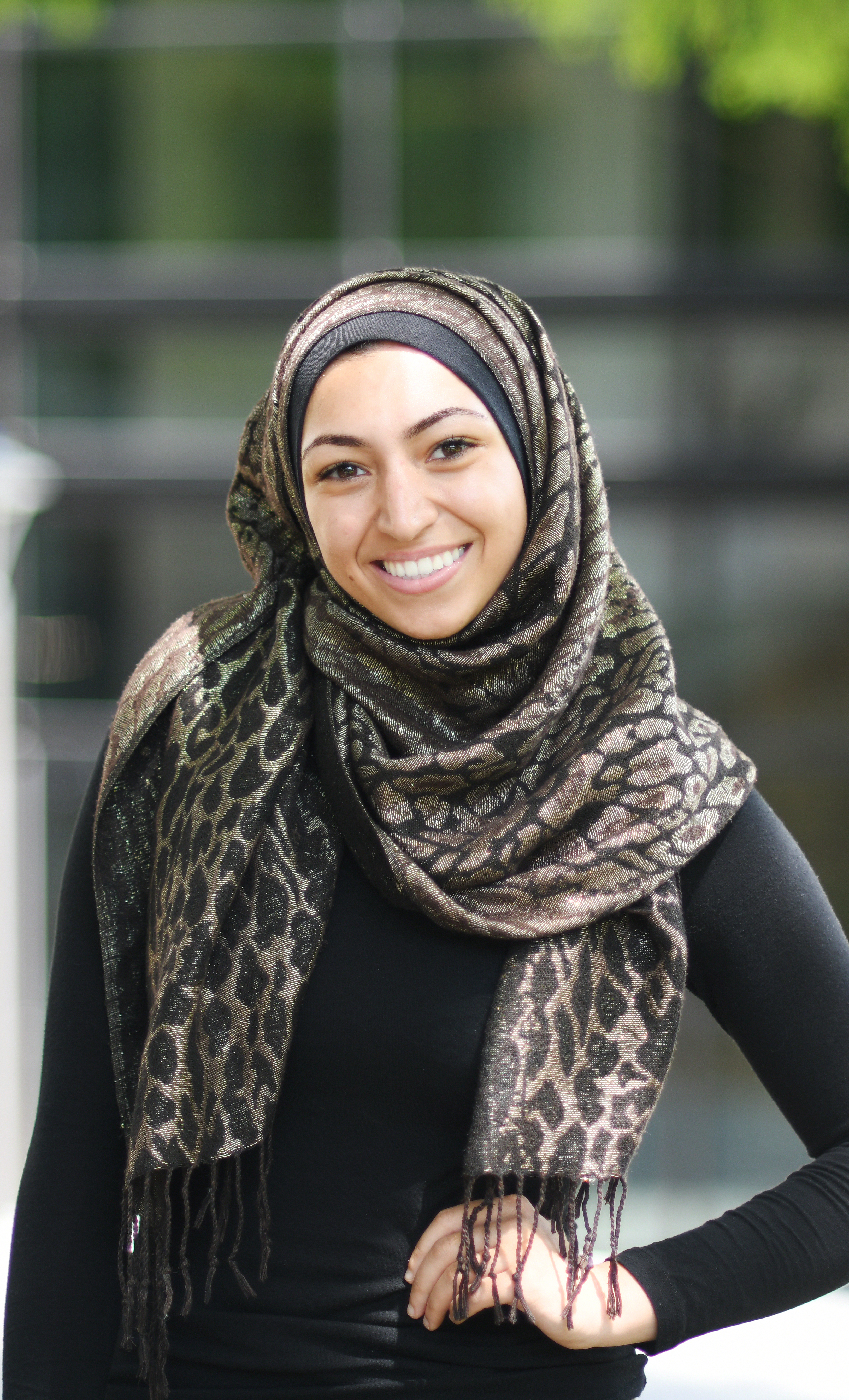 Female student, wearing hijab, smiling