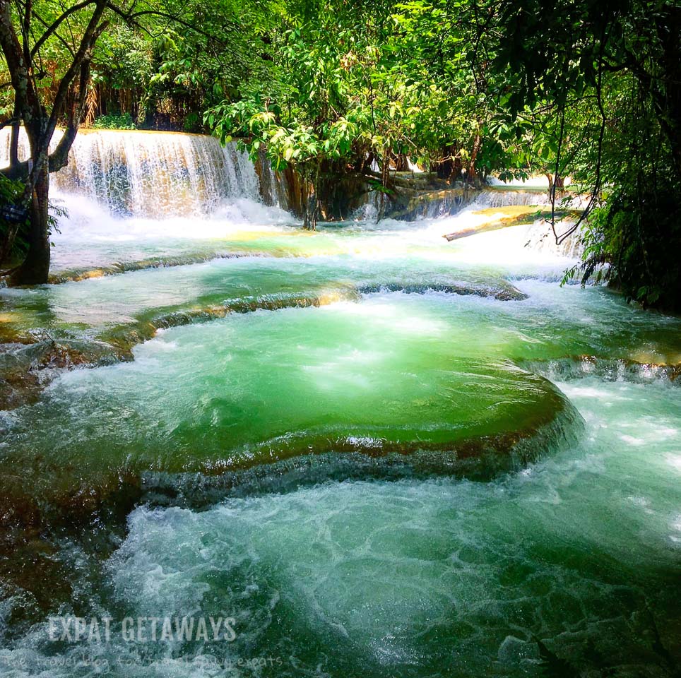 Swim in the turquoise pools of Kuang Si Falls. Luang Prabang, Laos. Expat Getaways, 48 Hours in Luang Prabang, Laos.