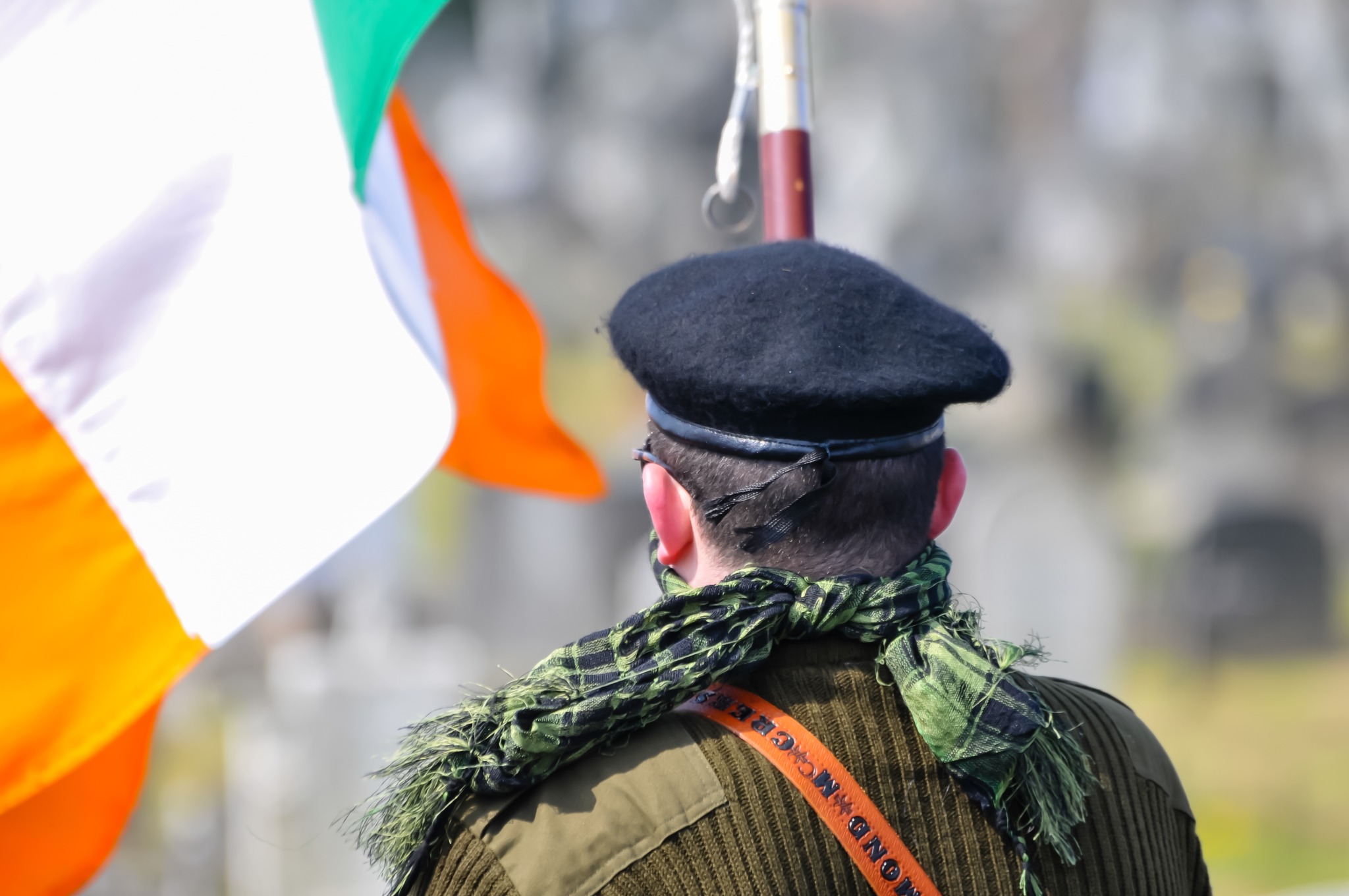 A man waving the Irish flag to commemorate the Easter rising of 1916