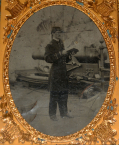 QUARTER-PLATE TINTYPE OF NAVY MASTER ON DECK IN NICE “UNION CASE” WITH MILITARY MOTIF