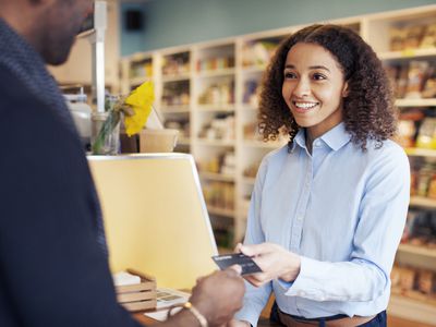 Customer paying at the store with debit card.