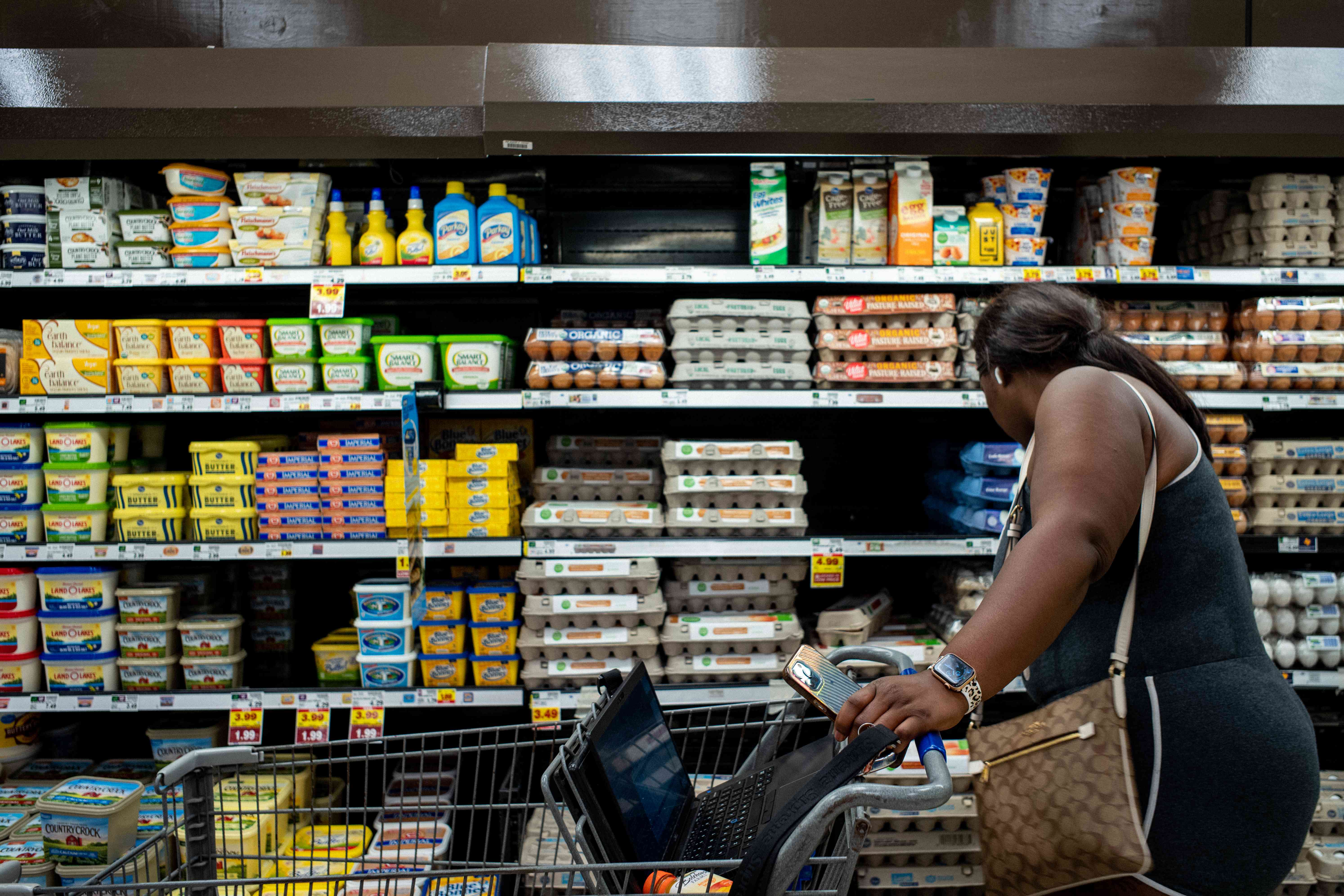 A customer shops for eggs in a Kroger grocery store on August 15, 2022 in Houston, Texas.