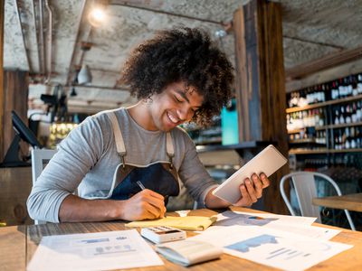 Smiling bookkeeper working at a restaurant