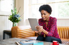 A woman uses a tablet