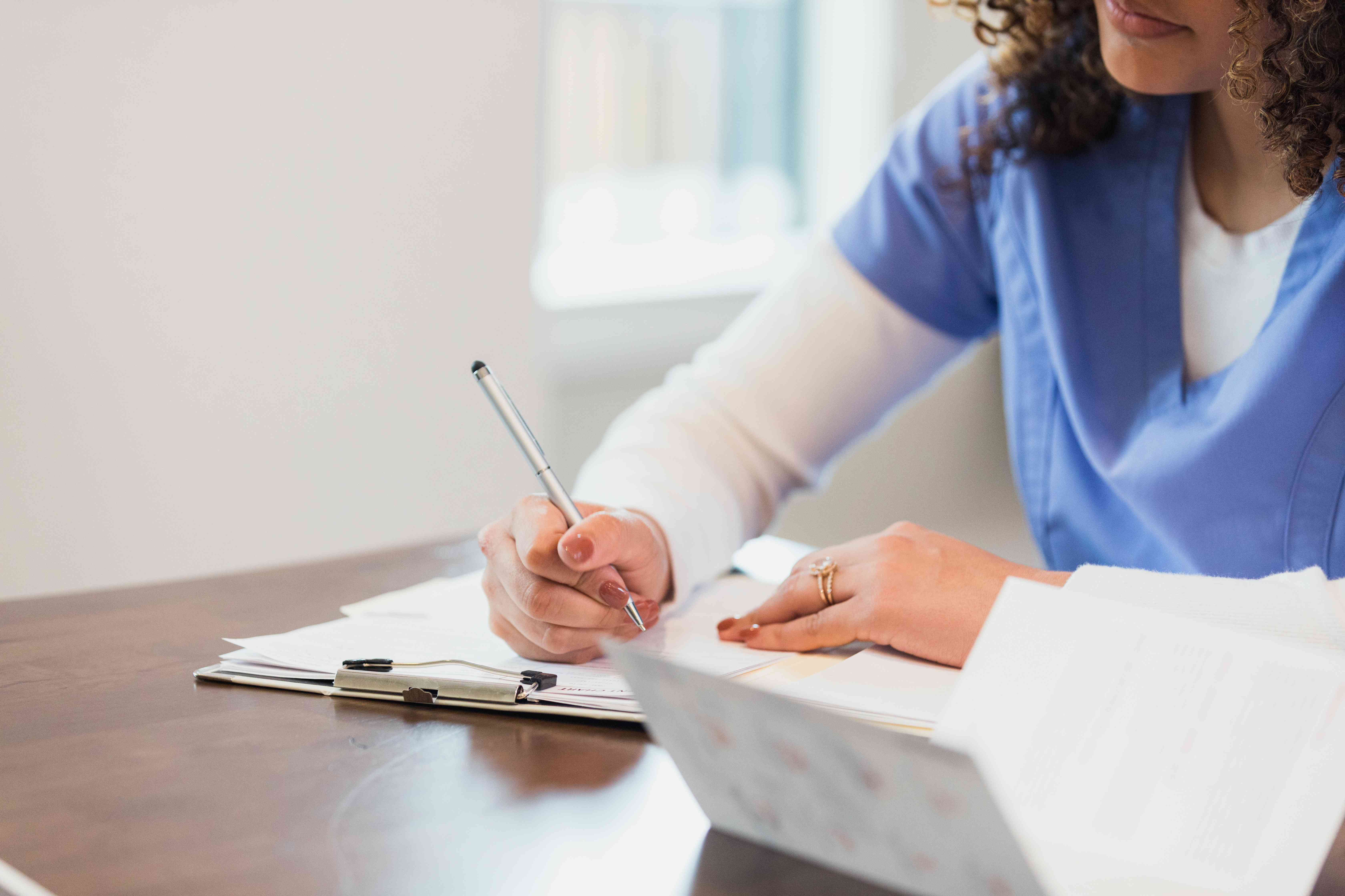 Healthcare worker filling out personal loan application