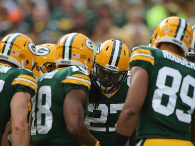 Running Back Eddie Lacy #27 of the Green Bay Packers gets a play call in the huddle against the New York Jets at Lambeau Field on September 14, 2014 in Green Bay, Wisconsin. 