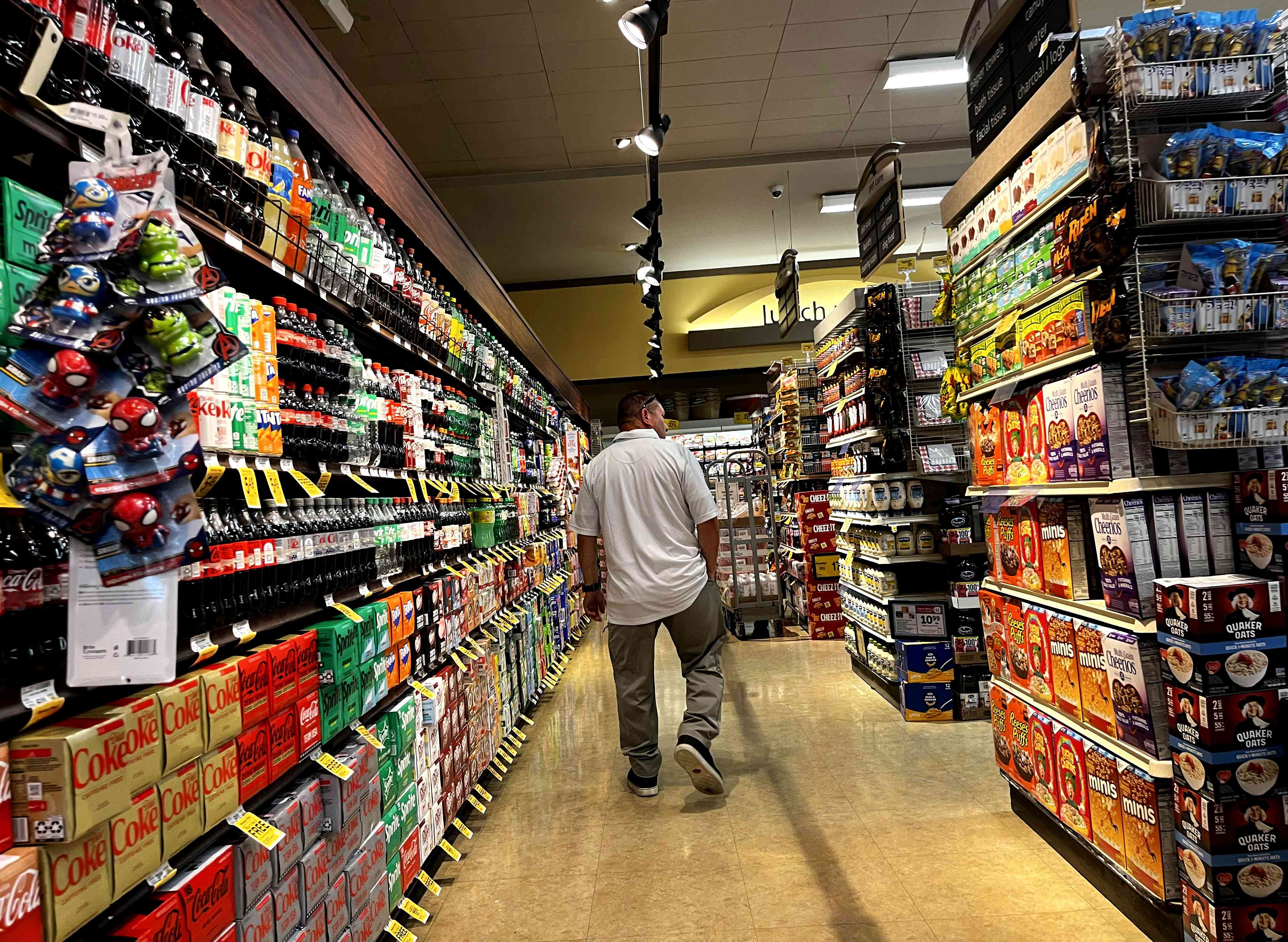 A shopper makes his way down an aisle at Vons market in Westchester, California on July 10, 2024. 