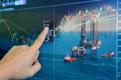 Stock market concept with oil rig in the gulf.
