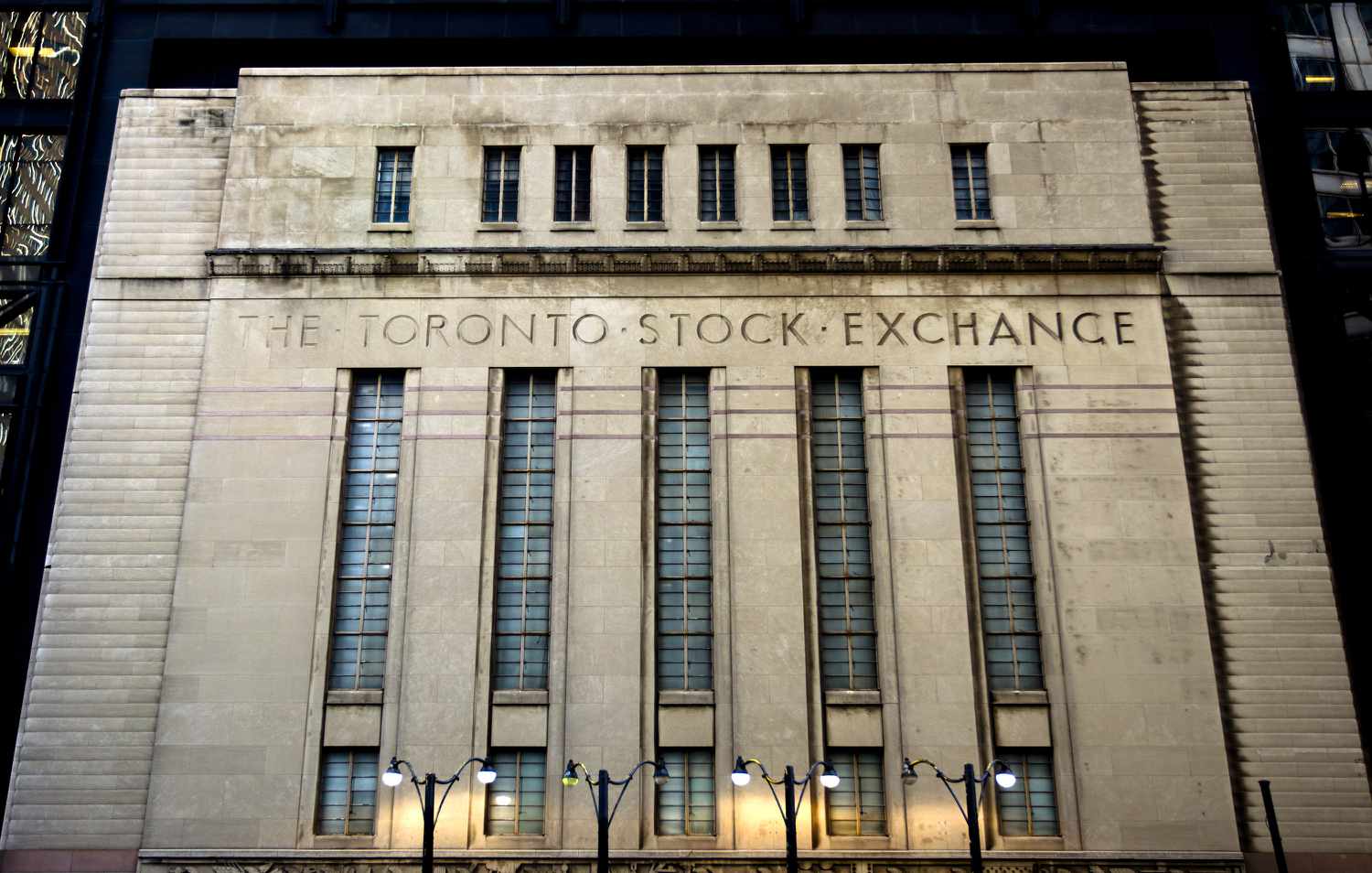 A front nighttime view of the Toronto Stock Exchange building in Toronto, Ontario, Canda.