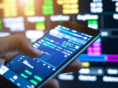 Cropped Image Of Man Checking Stock Market On Mobile Phone