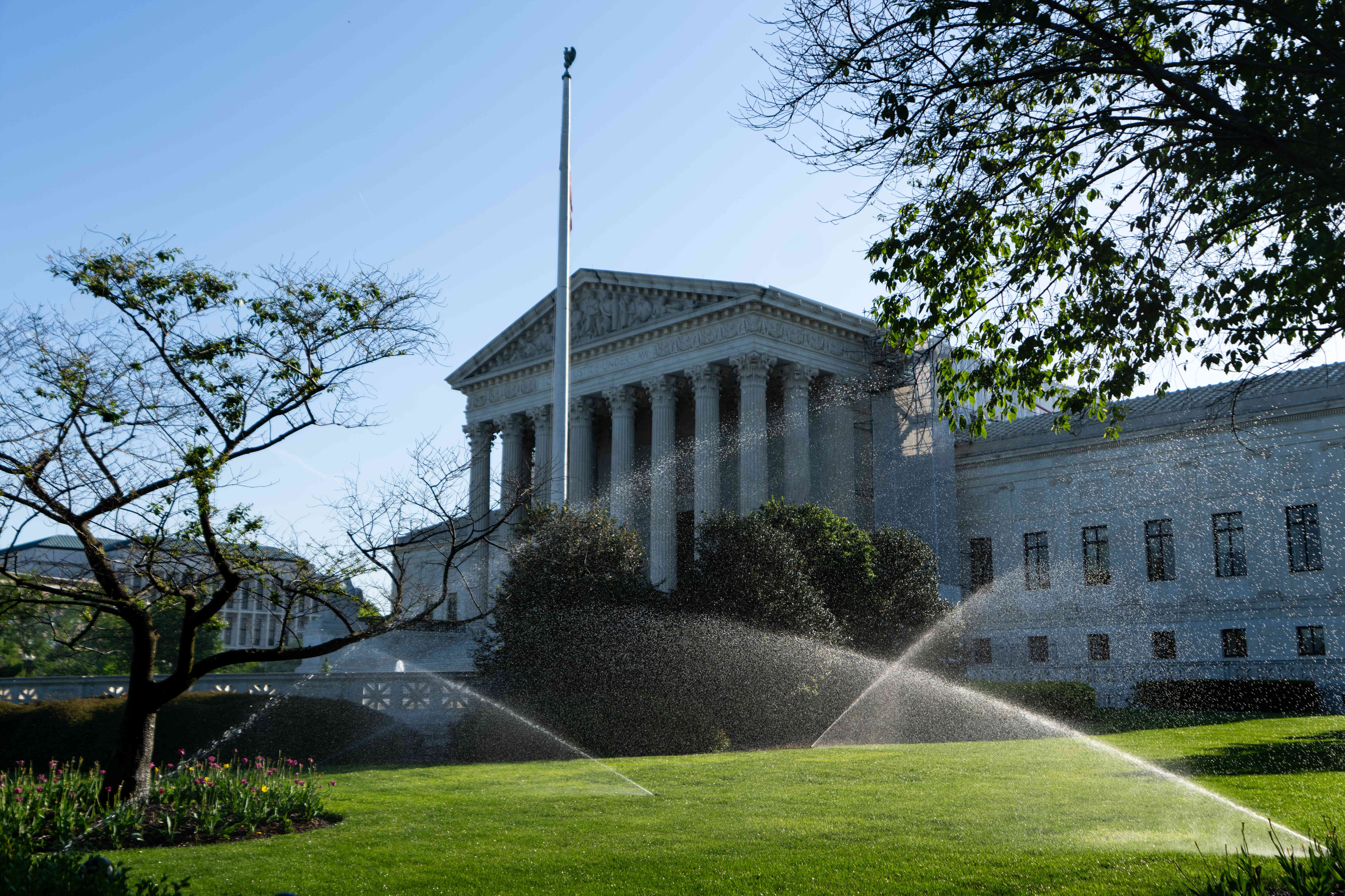 Sprinklers water the lawn in front of the U.S. Supreme Court on Monday morning, April 29, 2024.