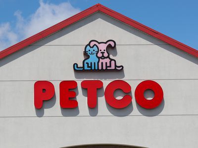 The Petco name and logo appears on a storefront in a shopping center.