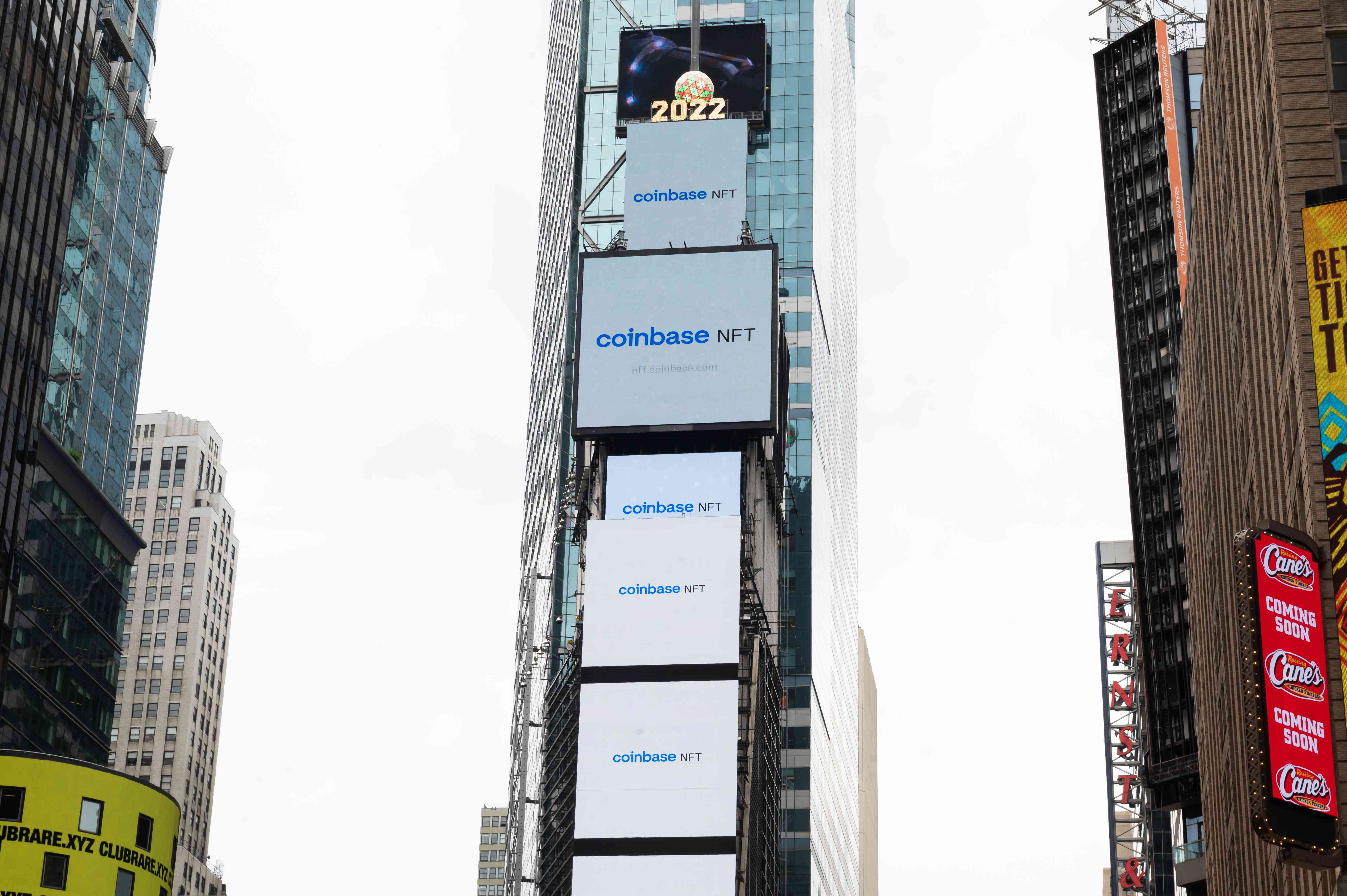 Billboards showing Coinbase NFT logo