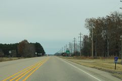 Telephone poles along US Route 64 in Arkansas.