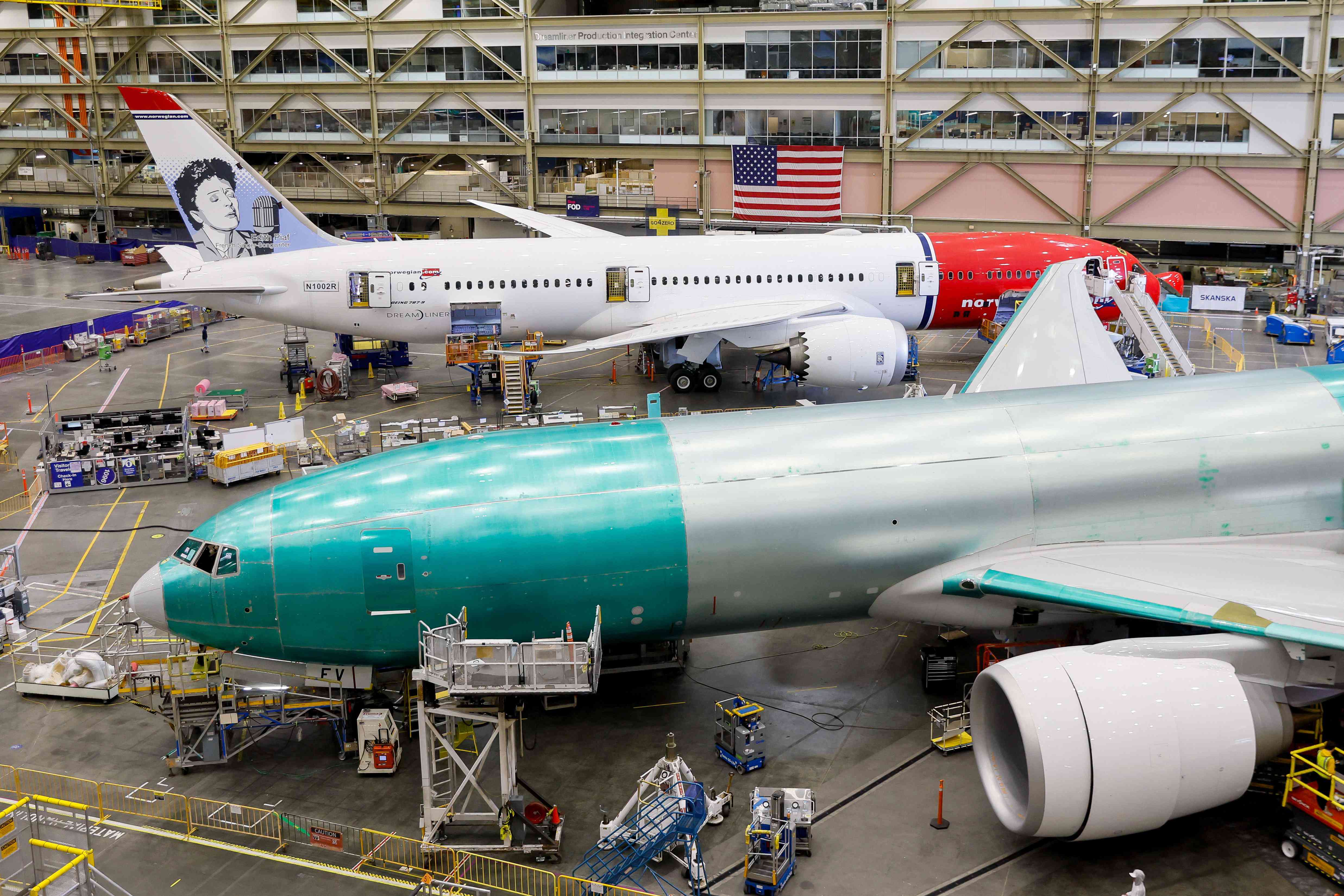 A Boeing 777 (front) and a 787-9 Dreamliner are under production at the Boeing Everett Production Facility in Everett, Washington, on June 26, 2024. 