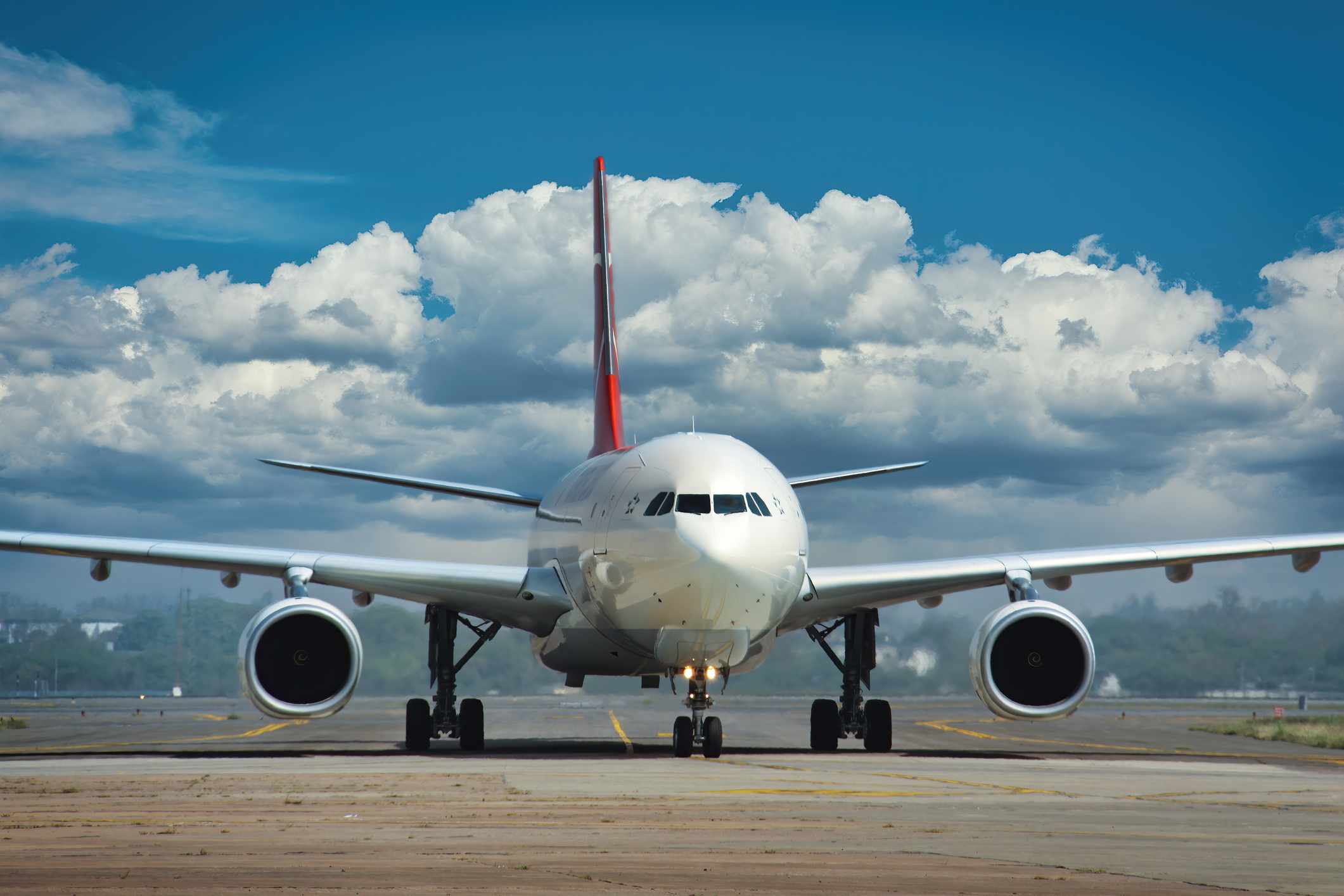 A wide body commercial airplane on runway.