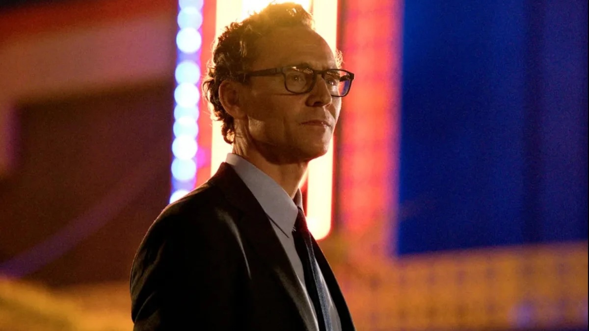 Picture of Tom Hiddleston in front of multicolored background from 'The Life of Chuck'