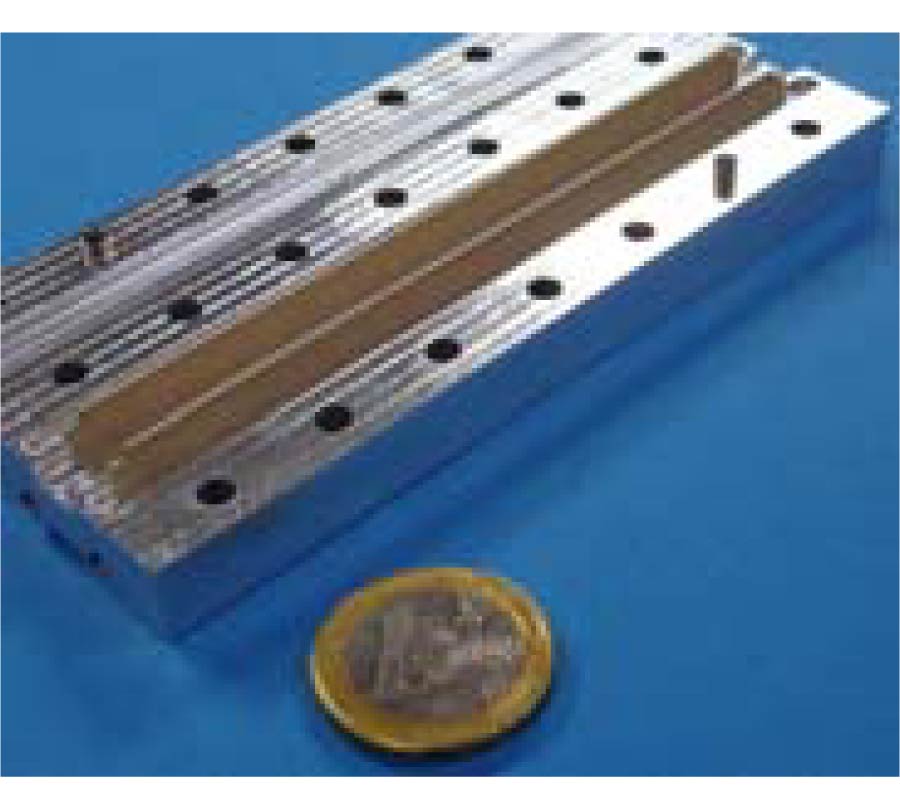 OPTIMIZATION OF THE E-PLANE LOADED RECTANGULAR WAVEGUIDE FOR LOW-LOSS PROPAGATION