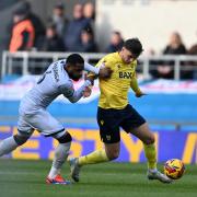 Mark Harris battles with Japhet Tanganga after coming on as a substitute