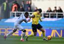 Mark Harris battles with Japhet Tanganga after coming on as a substitute