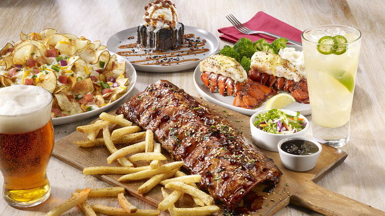 TGI Fridays Friday Feast ribs, lobster, loaded chips, and dessert with drinks