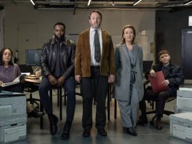 Izuka Hoyle, Dipo Ola, David Mitchell, Dorothy Atkinson, Gerran Howell looking seriously at the camera in a room with boxes filled with paperwork