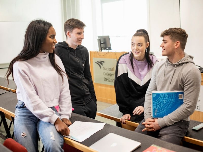 NCI students talking in a classroom