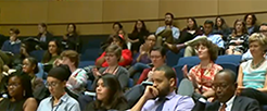 People sitting in an auditorium.