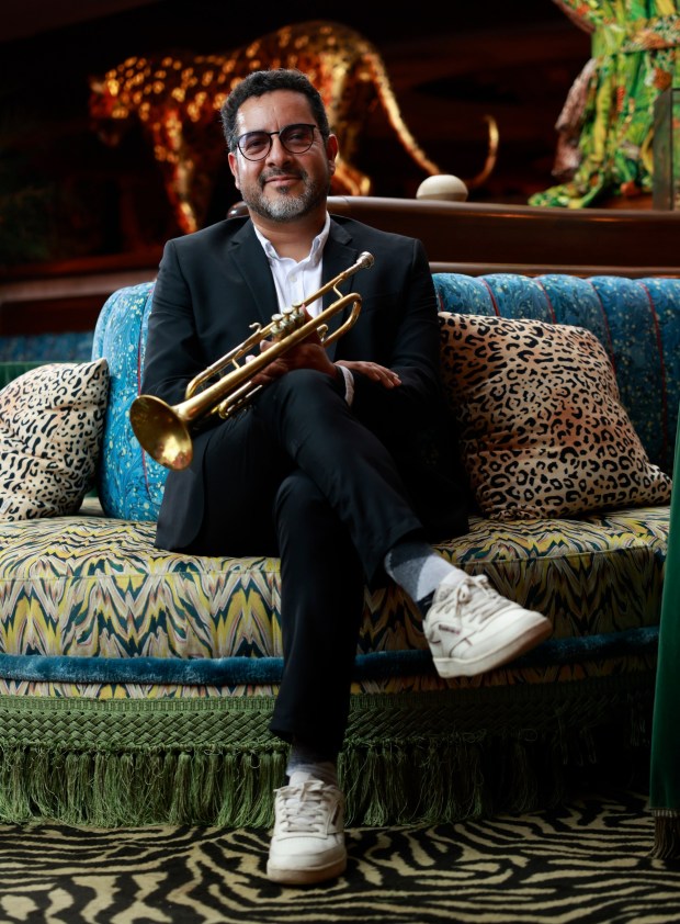 Ivan Trujillo is a trumpeter who lives in Ensenada but has a very active music career on both sides of the border, shown here at Lou Lou's Jungle Room club at the Lafayette Hotel in North Park before a performance on Saturday, Aug. 10, 2024. (K.C. Alfred / The San Diego Union-Tribune)