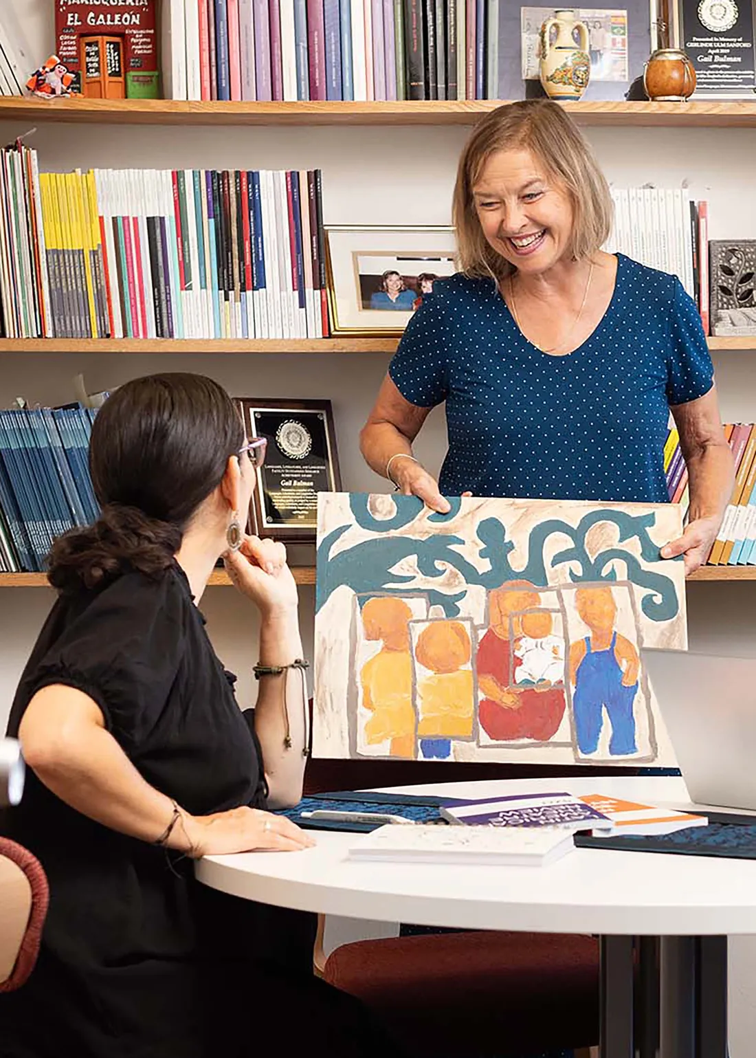 Gail Bulman talking with a student.