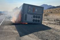 A 30-foot container, which was carrying lithium ion batteries, sits on the side of the road on ...